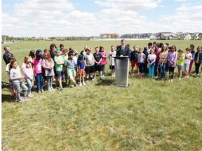 Saskatchewan Education Minister Don Morgan talks about the building of three new joint-use schools at the corner of Ambulet Drive and James Hill Road in Regina on June 15, 2015.  (DON HEALY/LEADER POST)