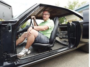 Saskatchewan Premier Brad Wall sits inside the shell of a 1970 Dodge Charger that will be customized and combined by Advanced Collision with parts from a 2015 Dodge Charger SRT.