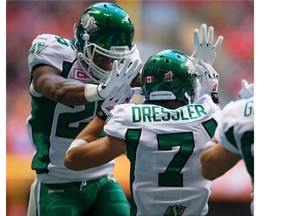Saskatchewan Roughriders' Anthony Allen, left, and Weston Dressler celebrate Dressler's touchdown against the B.C. Lions during the first half of a CFL football game in Vancouver, B.C., on Friday July 10, 2015. THE CANADIAN PRESS/Darryl Dyck