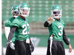 Saskatchewan Roughriders Mario Norman, left gets some help from Macho Harris at practice at mosaic Stadium in Regina on Thursday.