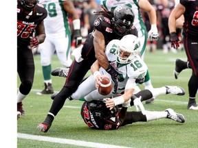 Saskatchewan Roughriders quarterback Brett Smith, 16, reaches out to make a two-point convert Sunday against the host Ottawa Redblacks. Smith was later pulled after throwing an interception and the Roughriders ended up losing 35-13, falling to 0-9. 
 Justin Tang/The Canadian Press