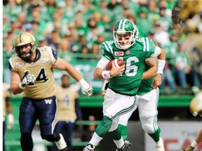 Saskatchewan Roughriders’ quarterback Brett Smith runs the ball against the Winnipeg Blue Bombers during first half CFL action in Regina, Sask., on Sunday, Sept. 6, 2015.