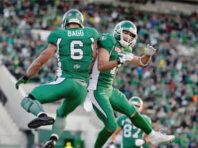 The Saskatchewan Roughriders' Weston Dressler, right, shown celebrating in the end zone with fellow receiver Rob Bagg on Saturday against the visiting Calgary Stampeders, has just become th third Roughriders to reach the 500 mark in career catches. 
  
  
 Michael Bell/Leader-Post files