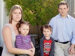 Shantel, left, and Lyle Andrusiak, right, pose with their children Lexi, centre left, and Landen, centre right, in front of a tree planted in the memory of their son Jayce at their home in Regina on Sept. 26, 2015. The family will participate in an annual Perinatal Loss Memorial Gathering, as they have every year since Jayce’s death in 2010. (Michael Bell/Regina Leader-Post)