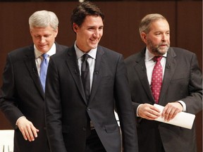 Liberal Leader Justin Trudeau, left to right, Conservative Leader Stephen Harper and NDP Leader Tom Mulcair leave the stage following the Munk Debate on Canada's foreign policy in Toronto, on Monday, Sept. 28, 2015.