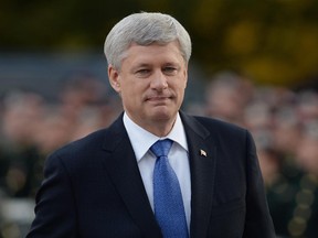 Prime Minister Stephen Harper arrives at a ceremony marking the one-year anniversary of the attack on Parliament hill Thursday Oct. 22, 2015 at the National War Memorial in Ottawa. There are three petitions generating a heated debate on whether the Calgary International Airport should be renamed for outgoing prime minister Stephen J. Harper.