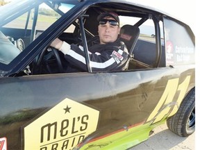 Stock-car racer Mike Goutch works on his car at Kings Park Speedway in Regina on September 10, 2015.