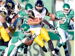 Tearrius George, shown tackling Hamilton Tiger-Cats quarterback Zach Collaros on Sunday, and the other members of the Saskatchewan Roughriders' defence are looking to improve. 
  
 Troy Fleece/Leader-Post files