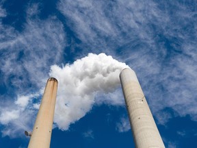 The smoke stacks at American Electric Power's (AEP) Mountaineer coal power plant in New Haven, West Virginia, October 30, 2009. In cooperation with AEP, the French company Alstom unveiled the world's largest carbon capture facility at a coal plant, so called "clean coal," which will store around 100,000 metric tonnes of carbon dioxide a year 2.1 kilometers (7,200 feet) underground.