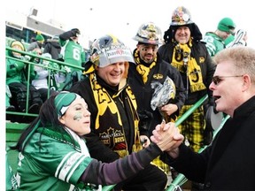 There is speculation that former Saskatchewan Roughriders general manager Eric Tillman, shown on the right before the 2013 Grey Cup game, could return to the Green and White.