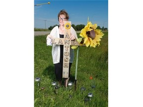 Wanda Campbell stands at a cross that memorializes her son Lane Campbell Antosh at the Trans-Canada Highway, 4 km south of Pilot Butte on Saturday August 1, 2015. Lane Antosh was killed at this spot August 9, 2013. Campbell wants the provincial government to make the crossing more safe.