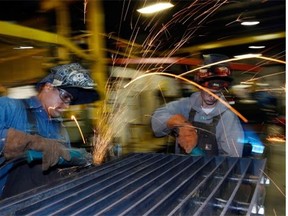 Welders work on a piece of equipment being manufactured at JR’s Welding shop in Regina in this 2013 file photo. Average salaries are expected to increase 2.7 per cent in Saskatchewan next year. (BRYAN SCHLOSSER/Regina, Leader-Post.)