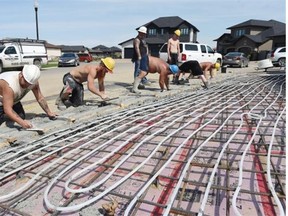 Work crews with Zaryski Construction Ltd. prepare a driveway with infloor heating for concrete in Regina on Tuesday. (DON HEALY/Leader-Post)
