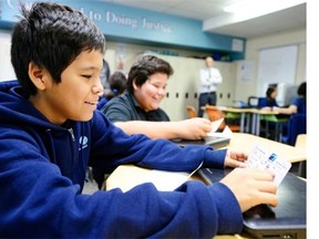 Xavier Severight , grade 8 student at Mother Teresa Middle School, smiles as he looks at his WestJet ticket to We Day in Ottawa, on Oct. 16, 2015.