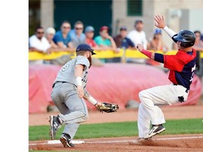 Red Sox Zach Weatherford beats the tag at third by Weyburn’s Alex Jones during Regina Red Sox playoff action vs. the Weyburn Beavers at Currie Field in Regina on Monday. Weyburn beat Regina 1-0. The Red Sox still lead the best-of-five series 2-1, with Game 4 going tonight at Currie Field.