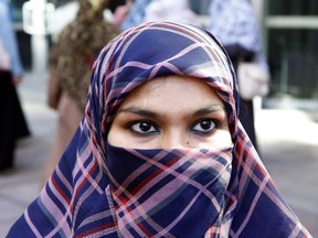 Zunera Ishaq talks to reporters outside the Federal Court of Appeal in Ottawa on Tuesday, September 15, 2015. Ishaq, who won the legal right to wear a niqab during her citizenship oath. has officially become Canadian.