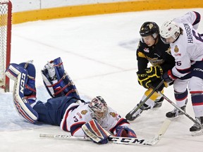 Regina Pats goaltender Tyler Brown throws himself on a loose puck Friday against the host Brandon Wheat Kings. Brown made 51 saves in a 2-1 Wheat Kings victory.