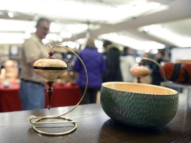 A Christmas ornament hangs at Dale Lowe's stall at Wintergreen Fine Craft Market in Regina, Sask. on Saturday Nov. 21, 2015. The annual event is organized by the Saskatchewan Crafts Council, which celebrates its 40th anniversary this year.