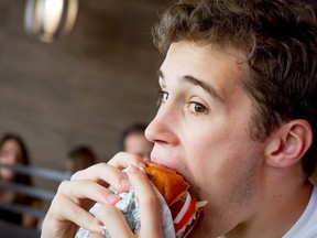 Aidan Katz tucks into a portobello thickburger at Carl's Jr. Charbroiled Burgers.