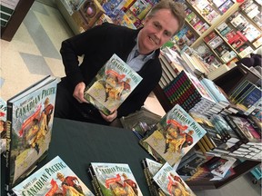Barry Lane is surrounded by copies of his book, Canadian Pacific: The Golden Age of Travel, at Coles bookstore in Regina's Northgate Mall on Nov. 20, 2015.
