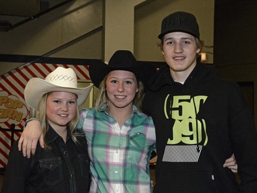 Brooke Herlick, Kennedy Herlick and Reed Duncan at the rodeo at Agribition held at the Brandt Centre in Regina, Sask. on Saturday Nov. 28, 2015.