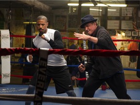 Caption: (L-r) MICHAEL B. JORDAN as Adonis Johnson and SYLVESTER STALLONE as Rocky Balboa in Metro-Goldwyn-Mayer Pictures', Warner Bros. Pictures' and New Line Cinema's drama "CREED," a Warner Bros. Pictures release. Photo Credit: Barry Wetcher