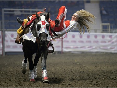 Cashlyn Krecklau, a rider with Calamity Cowgirls, rights herself after performing a trick at Agribition at the Brandt Centre in Regina, Sask. on Saturday Nov. 28, 2015. (Michael Bell/Regina Leader-Post)