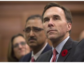 Minister of International Trade Chrystia Freeland, left to right, Minister of Infrastructure and Communities Amarjeet Sohi, and Minister of Finance Bill Morneau take part in a Liberal caucus meeting on Parliament Hill in Ottawa on Thursday, November 5, 2015.