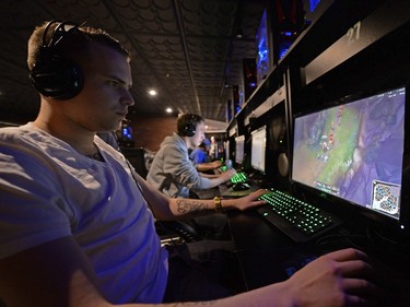 Devin Johnson, left, warms-up before playing League of Legends at a SKLeague eSports tournament held at Matrix Gaming Centre in Regina, Sask. on Saturday Nov. 7, 2015. (Michael Bell/Regina Leader-Post)