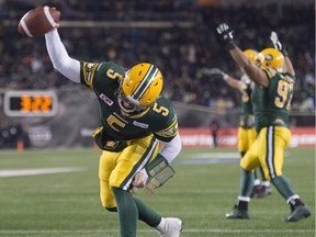 The Edmonton Eskimos' Jordan Lynch celebrates his one-yard touchdown run — a Grey Cup-winning touchdown that was set up by a defensive pass interference call against the Ottawa Redblacks.