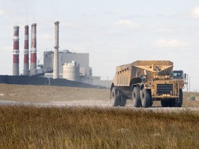 File — A coal truck leaves the Boundary Dam facility in Estevan on Aug. 16, 2012.