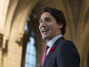 Prime Minister Justin Trudeau laughs as he speaks to the media on Parliament Hill, Nov. 5.
