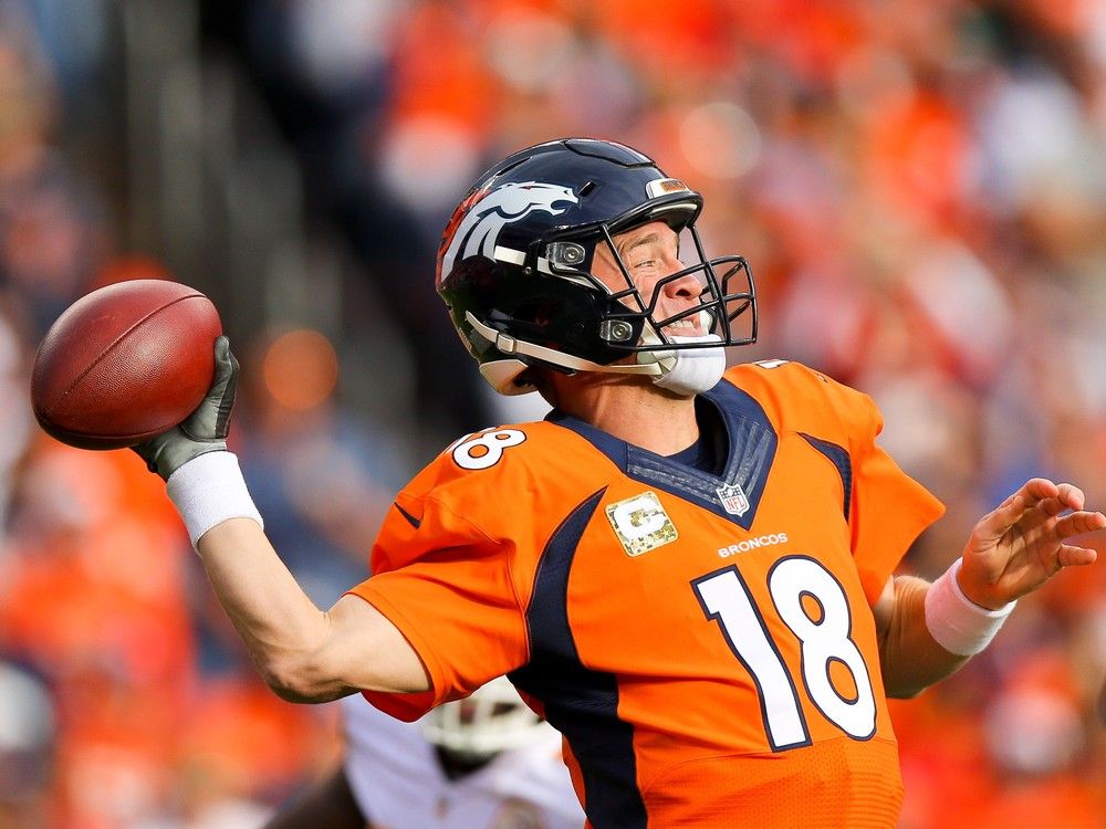 Denver Broncos quarterback Peyton Manning wears a glove on his