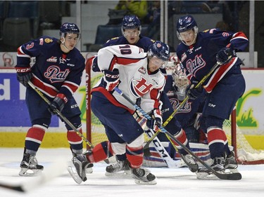 Lethbridge Hurricanes forward Cory Millette (#10) looks down to find the puck in his skates in front of the Regina Pats goal at the Brandt Centre in Regina, Sask. on Sunday Nov. 15, 2015.