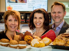 Lisa MacMurchy, centre, and her husband Ken are the founders and owners of Brewed Awakening. Linda Little, baker, is one of the partners in the coffee business. Photo by CJ Katz