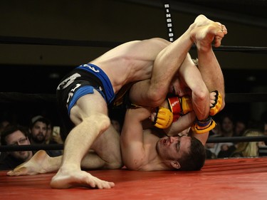 Matt Fedler, bottom, seems to be dominated by Jesse Boldt, top, during their MMA fight at Saturday Night Fights held at the Conexus Arts Centre in Regina, Sask. on Saturday Nov. 14, 2015.