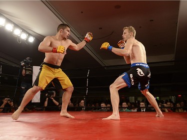 Matt Fedler, left, and Jesse Boldt, right, fight at MMA Saturday Night Fights held at the Conexus Arts Centre in Regina, Sask. on Saturday Nov. 14, 2015.