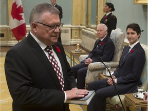 Governor General David Johnston and Prime Minister Justin Trudeau look on as Ralph Goodale is sworn in as the Minister of Public Safety and Emergency Preparedness during ceremonies at Rideau Hall, Wednesday Nov.4, 2015 in Ottawa.