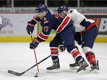 Regina Pats forward Adam Brooks (#77) passes for an assist on the game winning goal against the Lethbridge Hurricanes at the Brandt Centre in Regina, Sask. on Sunday Nov. 15, 2015.