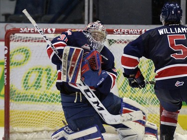 Regina Pats goalie Tyler Brown (#31) traps the shot during a game against the Lethbridge Hurricanes at the Brandt Centre in Regina, Sask. on Sunday Nov. 15, 2015.