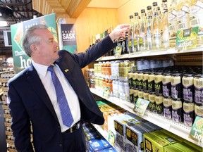 Minister responsible for SLGA Don McMorris looks over Saskatchewan product at the South Albert Liquor store.