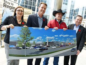 Regina Hotel Association (RHA) board president Cari Lemieux (L-R), Regina Mayor Michael Fougere,  Canadian Western Agribition (CWA) president Stewart Stone and Mark Allan, president and CEO of Evraz Place hold an artists drawing of the new International Trade Centre at Evraz Place on November 3, 2015.
