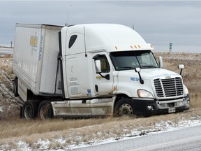 Icy roads took their toll on Saskatchewan highways Wednesday and contributed to this semi-trailer truck sliding off the road on the Trans-Canada highway near Pinkie Road. (DON HEALY/Regina Leader-Post)