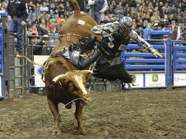 JC Curley takes a wild ride on Paper Lion during Bull Riding at the Canadian Cowboys Association Finals Rodeo at the Canadian Western Agribition in Regina on Friday.