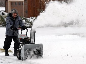 File — Joe Keller blows snow in west Regina on Nov 28, 2014.