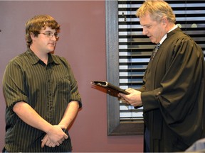 Jeff Poissant, left, was sworn in as a new reeve of the RM of Sherwood by Steven Schiefner, official administrator, on Nov. 4.