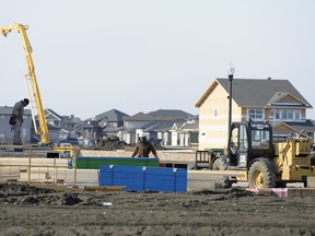 File — Construction crews work on new home construction in The Greens on Gardiner in Regina on Oct. 26, 2015.