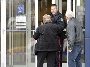 Regina Police service officers inside the RBC on the 5800 block of Rochdale Boulevard to investigate an incident on Tuesday.