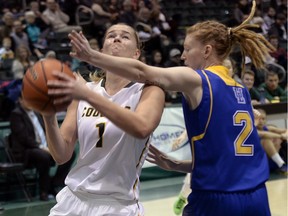 Charlotte Kot, left, is enjoying a strong season with the University of Regina Cougars women's basketball team.