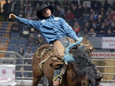 Kirk Thompson hangs on in the Saddlebronc event.